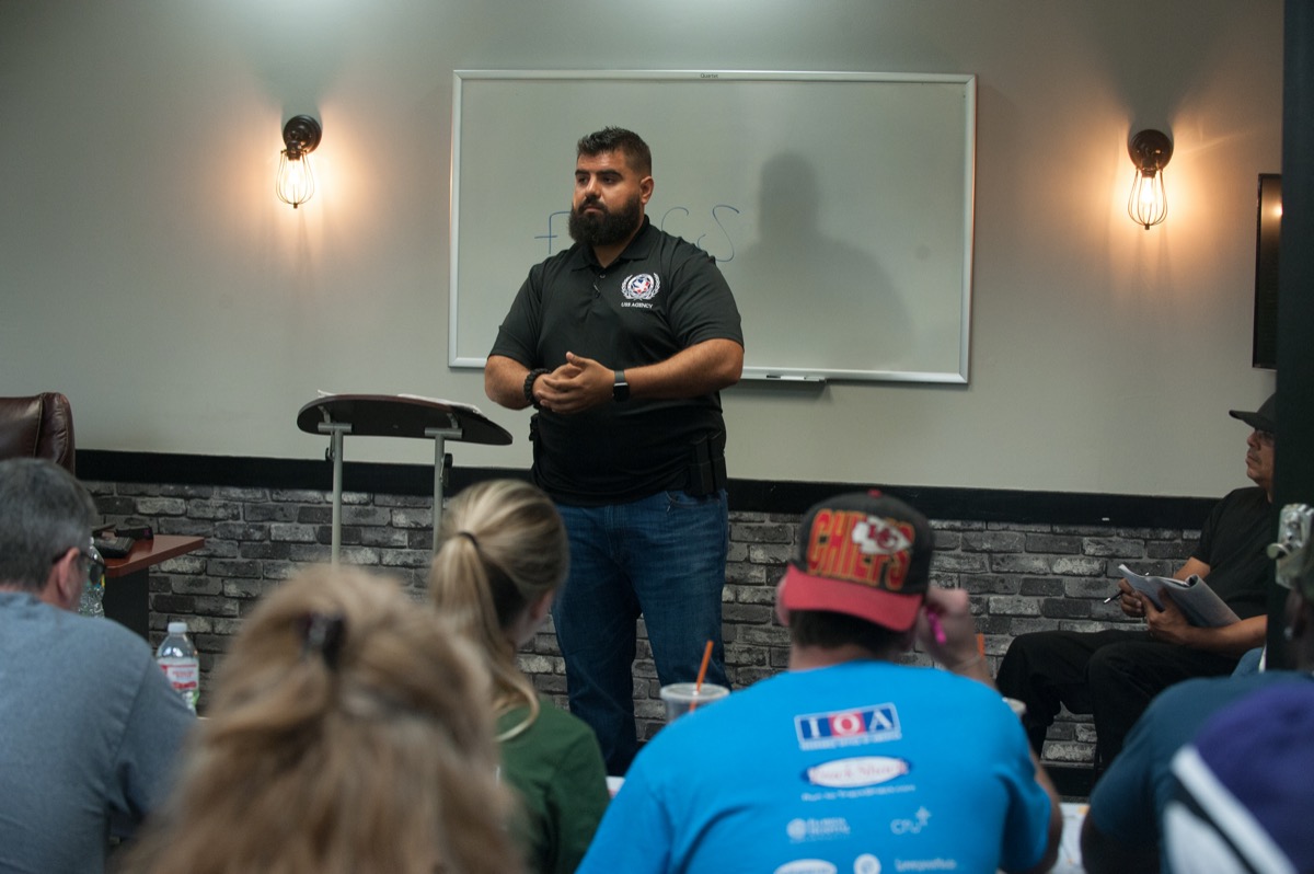 USS Academy instructor teaching firearms safety
