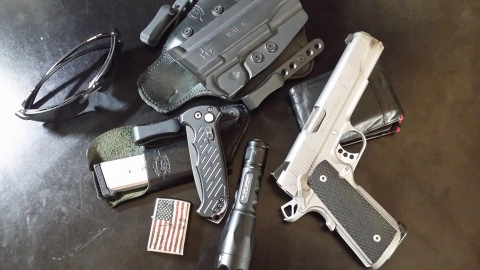 Everyday carry gear flatlay for concealed carry