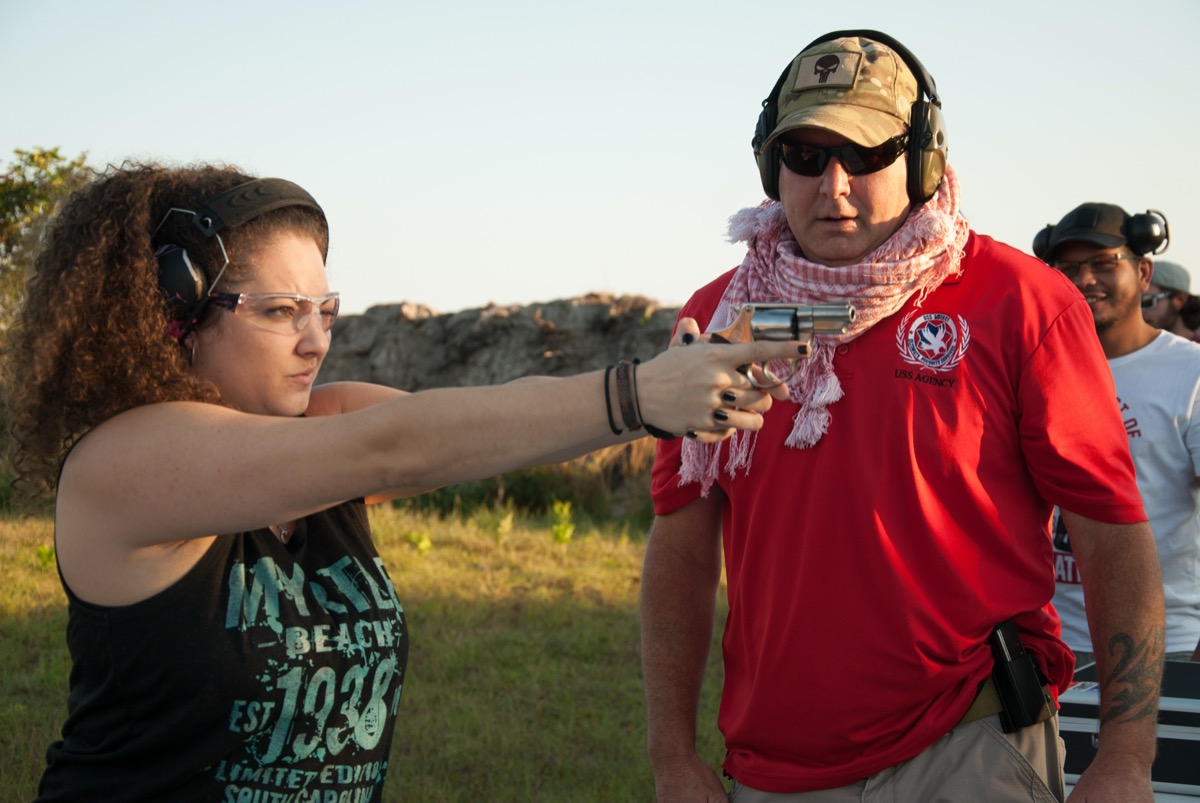 Instructor coaching student at the firing line