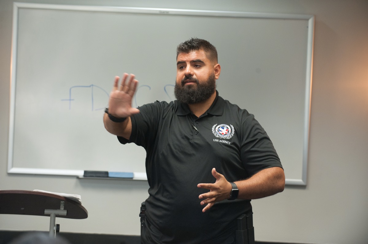 Instructor explaining safety techniques in class