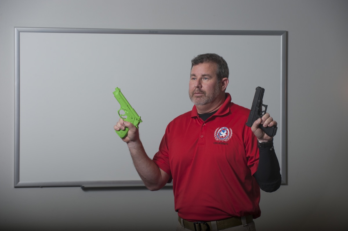 Lead instructor demonstrating training firearm