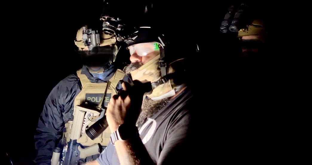 Close-up of night vision goggles and tactical equipment during USS Academy training