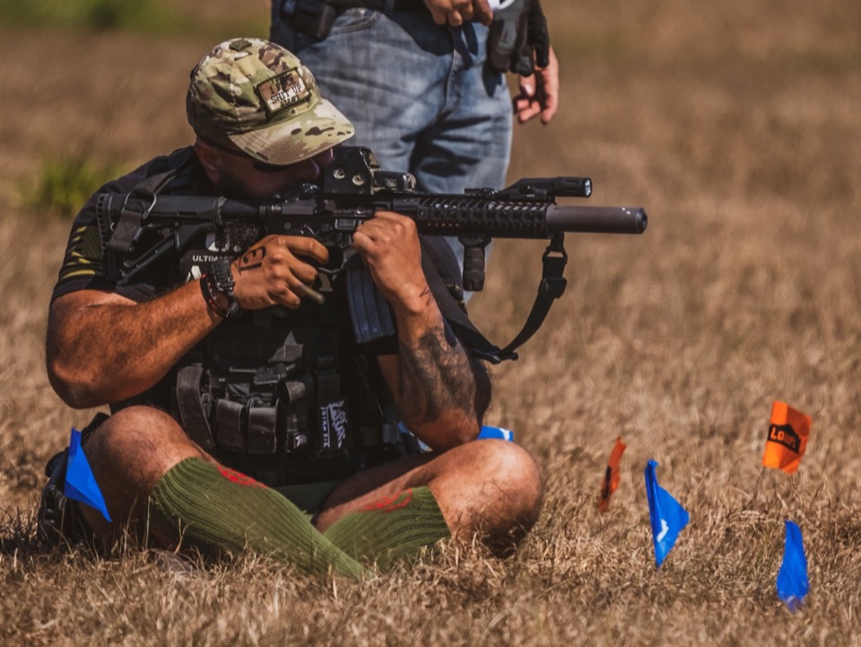 Tactical seated rifle training position